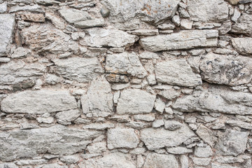 Rough grunge stone wall background.