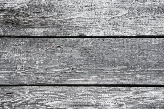 Black gray paint wooden desks background.