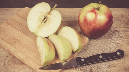 Fresh apple on a wooden background.