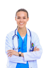 Beautiful young woman in white coat posing with hand in pocket. Woman doctor