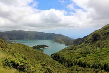 Fototapeta na wymiar The lake, hidden in the crater of the volcano. Lake of Fire (Lagoa do Fogo). San Miguel, Azores