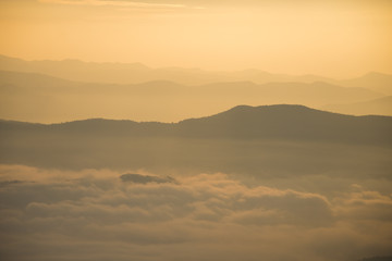 Layer of mountains and mist during sunset