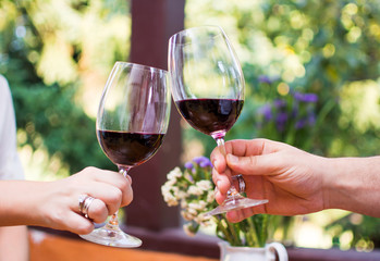 Couple toasting with glass of wine