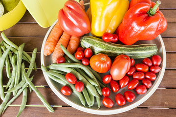 Summer vegetables on wooden background