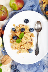Delicious crumble pie with apples and cinnamon. Sweet dessert.