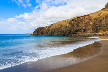Ocean wave on beautiful Prainha beach with golden sand, Madeira island, Portugal