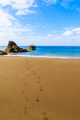 Fototapeta na wymiar View of beautiful Prainha beach with footprints on golden sand, Madeira island, Portugal