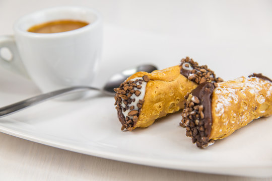 Sicilian Cannoli And Coffee On White Dish