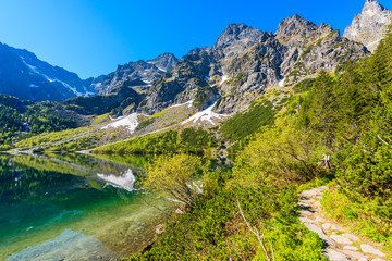 Fototapeta na wymiar View of Morskie Oko lake with emerald green water in summer season, High Tatra Mountains, Poland