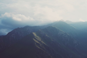 Dawn and mountains in the clouds