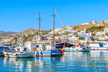 Fototapeta na wymiar Fishing boats anchoring in Mykonos port, Cyclades islands, Greece