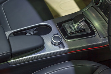 Detail of modern car interior focus on gear stick, Automatic transmission in luxury car
