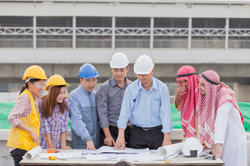 Harmonious Muslim engineer and technician team meeting in building construction site. Teamwork collaboration relation concept