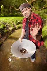 Contemporary lucky prospector showing nugget