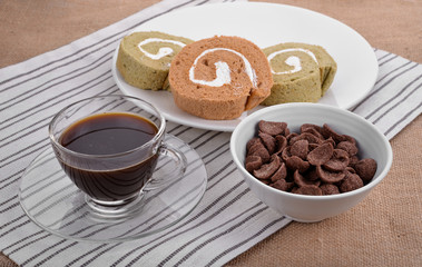 Jam roll with coffee
