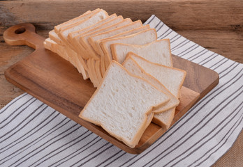 freshly baked  bread on wooden cutting board