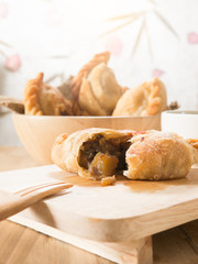 Group of curry puff with coffee.
