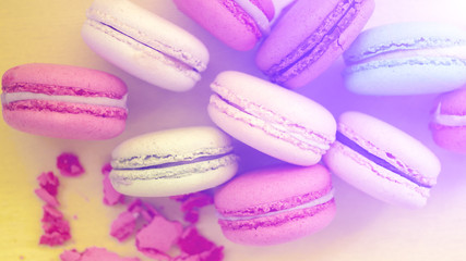 Macaroon. The bright colored rolls, cookies. The background substrate.