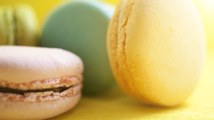 Macaroon. The bright colored rolls, cookies. The background substrate.