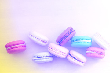 Macaroon. The bright colored rolls, cookies. The background substrate.