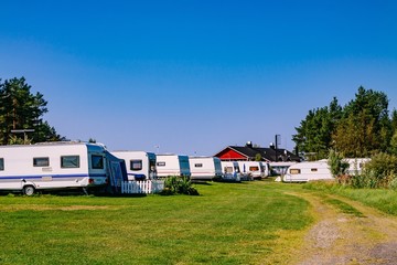 Fototapeta na wymiar Camping life with caravans in nature park