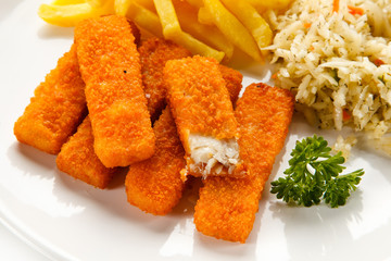 Fried fish sticks with french fries on white background