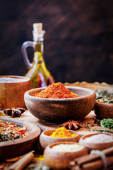 Spices and Herbs on Wooden Background