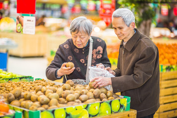 Senior Man and Woman Shopping Fruit.