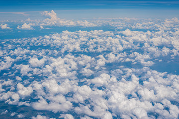 Fototapeta na wymiar The Altocumulus cloud formation view from aircraft window
