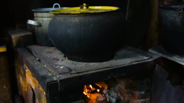 Old cast iron pot on a hand made stove