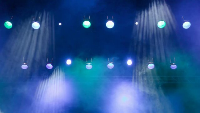 Lighting equipment on the stage. The spotlight through the smoke. Theater performance. Footage clip 4K