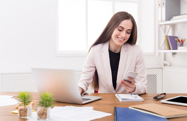 Young business woman working on phone