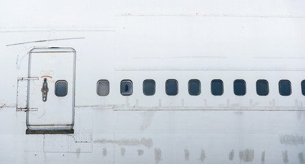 the side of airplane have the door and many window