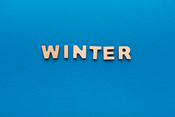Word Winter on blue background