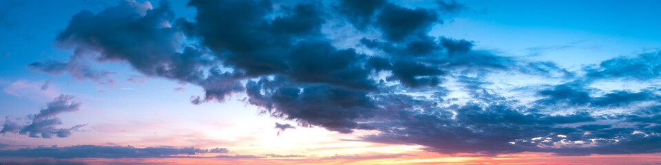 Naklejka na ściany i meble Vibrant panoramic sky on twilight time. Beautiful cloud. Panorama high resolution photograph.