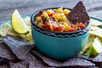 Fresh organic yellow peaches and peach salsa