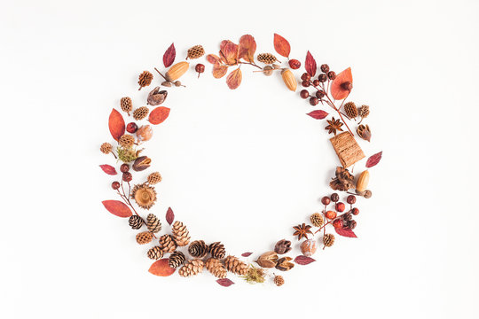Autumn composition. Wreath made of autumn leaves, pine conces, anise star. Flat lay, top view, copy space