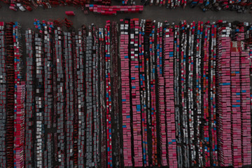 Obraz premium Warehouse containers in red on the street in the open air. Logistics center. Aerial view. From above