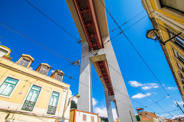 Fototapeta na wymiar 10 July 2017 - Lisbon, Portugal. The 25 de Abril Bridge is a bridge connecting the city of Lisbon to the municipality of Almada on the left bank of the Tejo river, Lisbon