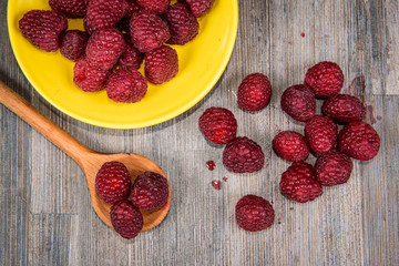 Fresh berries raspberry forest fruit on a wooden table 