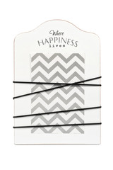 Board with twine and a piece of paper isolated on a white background