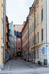 Fototapeta na wymiar Stockholm's narrow streets with different houses in colours