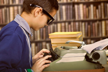  boy with the typewriter. Retro style portrait