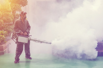 Obraz premium The man's fogging to eliminate mosquito for preventing spread dengue fever and zika virus
