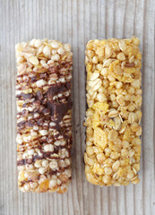 Healthy cereal bars on wood background