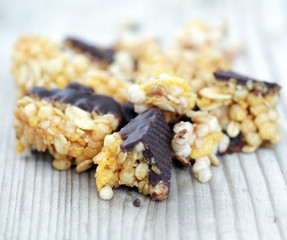 Healthy cereal bars on wood background