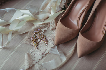 Wedding bouqet with shoes in the chair close-up
