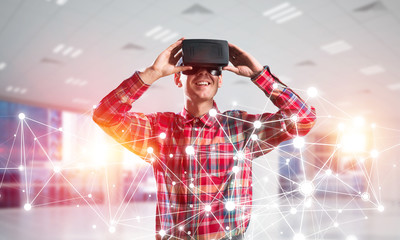 Fototapeta na wymiar Guy wearing checked shirt and virtual mask demonstrating some emotions