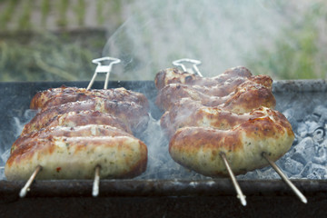 grilled sausage on a barbecue grill