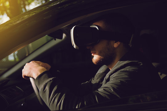 Man Learning To Drive With Virtual Reality Glasses